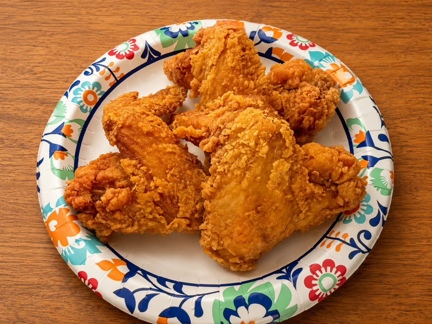 Crispy fried chicken pieces on a paper plate at China King, an Asian Restaurant in Merritt Island
